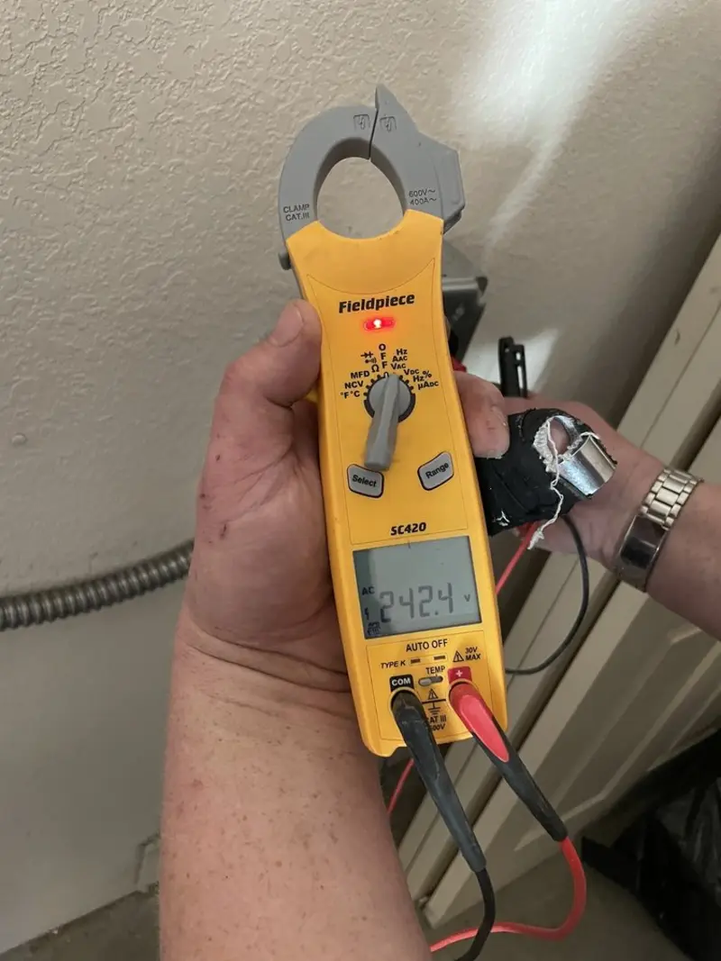Voltage testing with clamp meter during Ceiling Fan Installation in Marrero